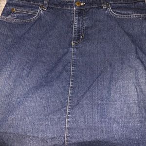 Knee length denim skirt, with slit in the back.
